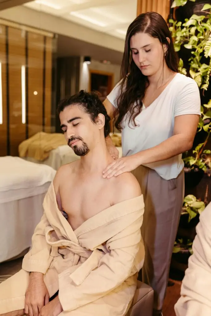Therapist performing a back massage in a calm setting